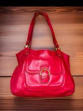 Coach Penelope pebbled leather buckle tote shoulder bag.